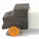 PEZ - Cab #R2 B Black Cab, Orange Wheels on white with white fender