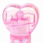 PEZ - hug me!  Italic Pink on Crystal Pink (c) 2008 on White hearts on short pink
